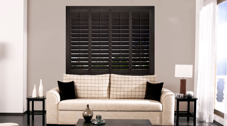 New York City sunroom with black shutters.